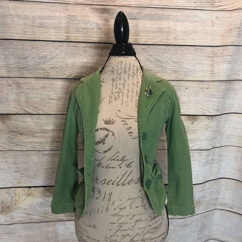 Green corduroy blazer. Turtle pin not included.